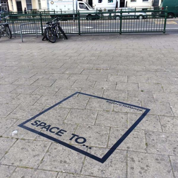 Space to dance sticker on the pavement
